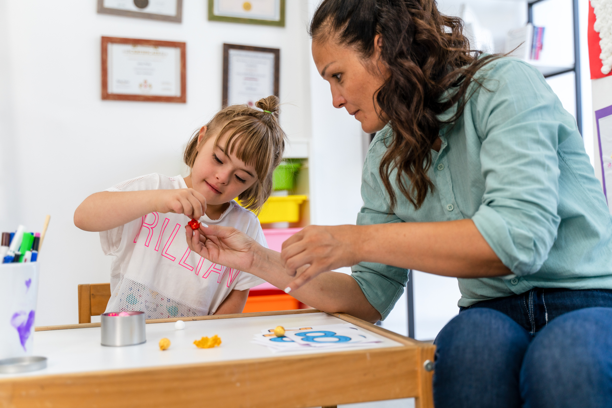 A Registered Behavior Technician working with a child during an ABA therapy session.