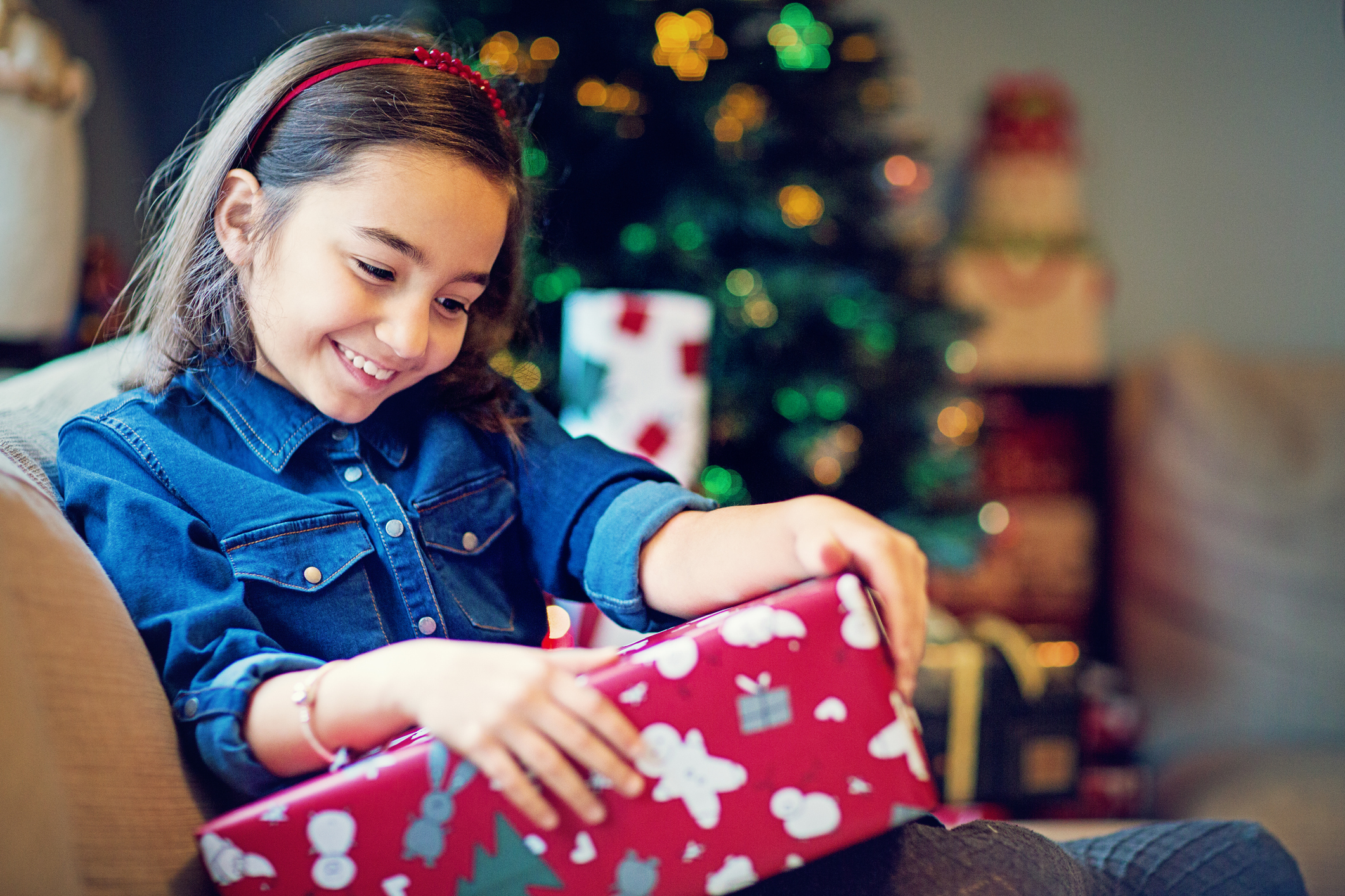 A girl with autism opening her presents