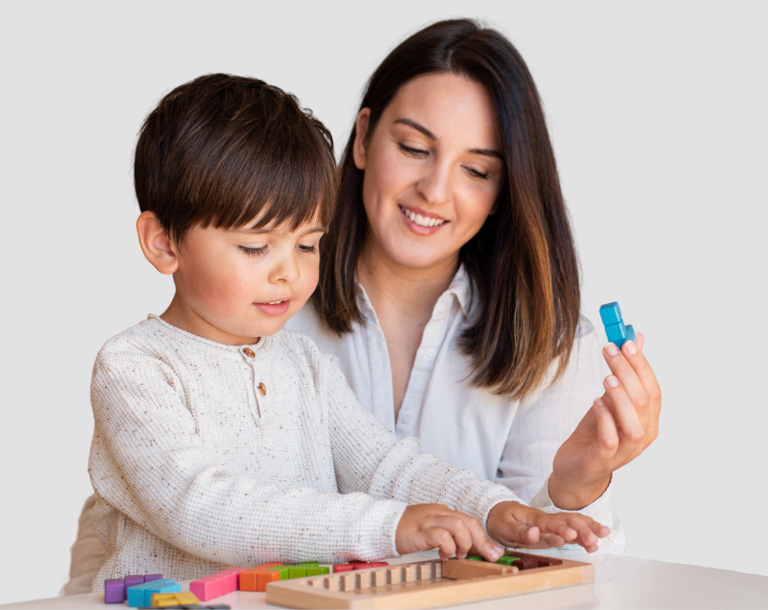 Mother and son playing a block puzzle game.