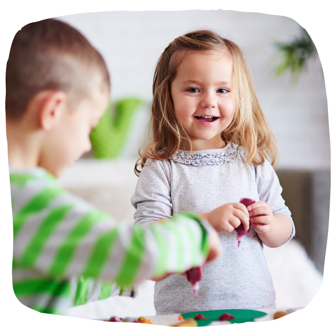 Happy kids playing at a table.