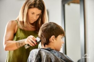Boy gets haircut at salon